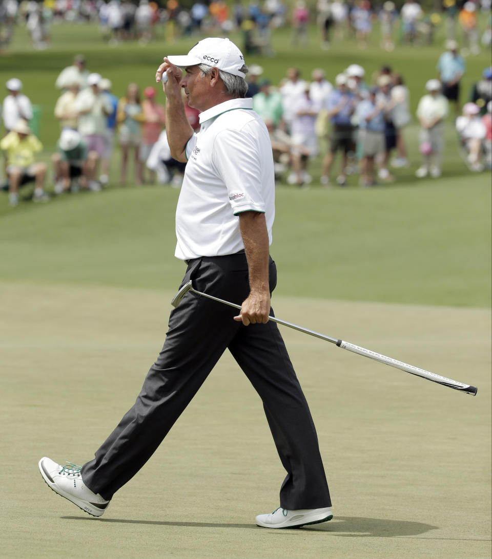 Fred Couples tips his cap after a birdie putt on the second hole during the second round of the Masters golf tournament Friday, April 11, 2014, in Augusta, Ga. (AP Photo/Chris Carlson)