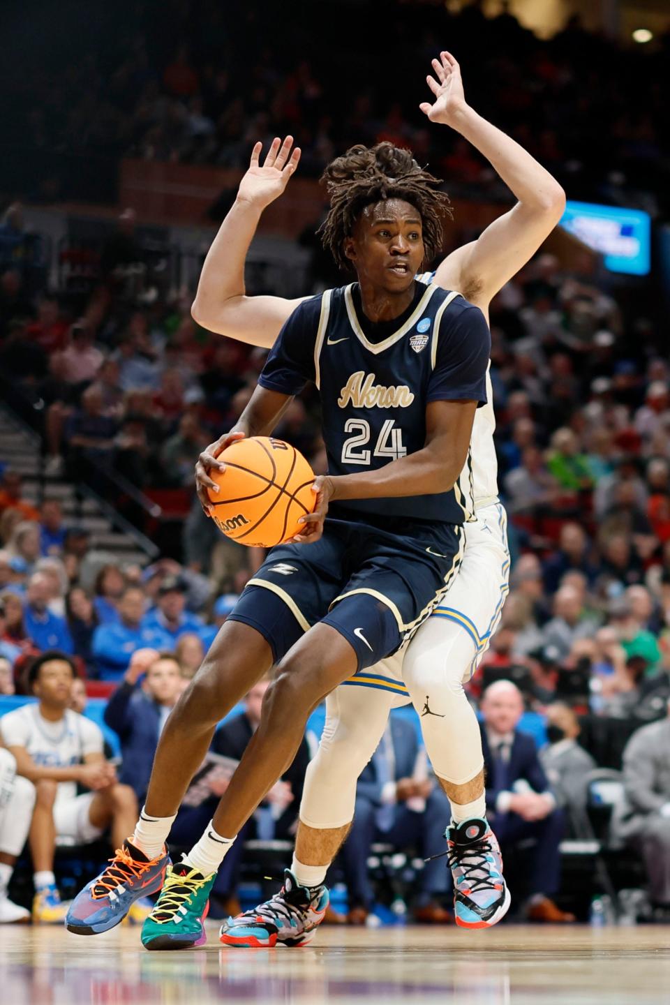 Akron Zips forward Ali Ali (24) controls the basketball against the UCLA Bruins during the first round of the 2022 NCAA Tournament on May 17, 2022, in Portland, Oregon.