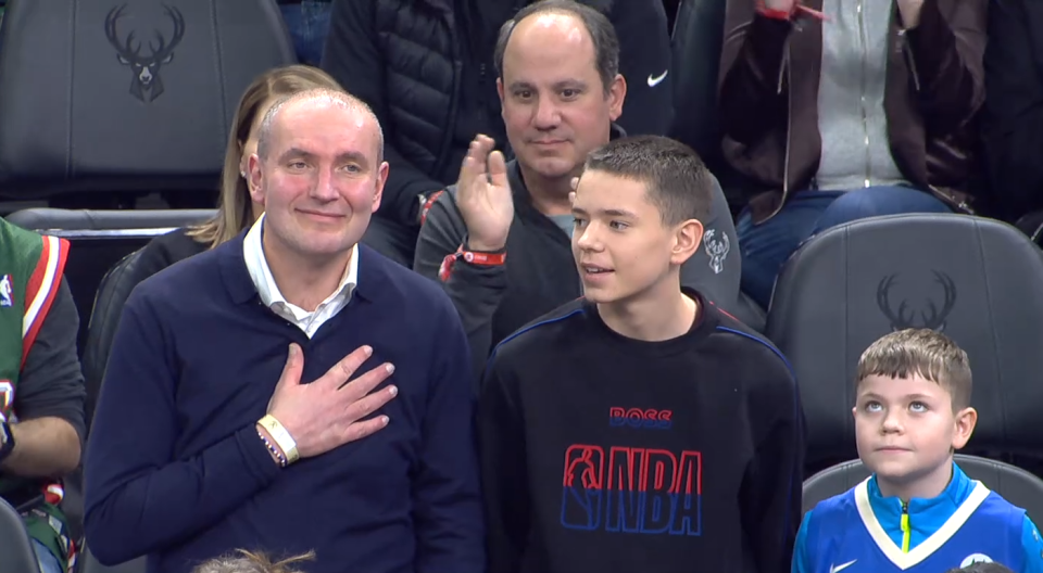 President Guðni Jóhannesson of Iceland and his two sons take in a game at Fiserv Forum between the Milwaukee Bucks and Boston Celtics on Feb. 14, 2023. Jóhannesson is the first known head of state to watch a Bucks game in person in Milwaukee.