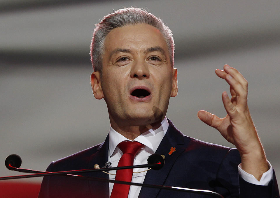 FILE - In this Sunday, Feb. 3, 2019 file photo Robert Biedron addresses the founding convention of his new centre-left party 'Wiosna' (Spring), in Warsaw, Poland. The left-wing party leader in Poland has won praise across the political spectrum for rescuing a 2-year-old boy and his father from a burning car. The accident occurred Monday evening in Tabor, south of Warsaw, when a car collided with a truck and began to burn. (AP Photo/Czarek Sokolowski)