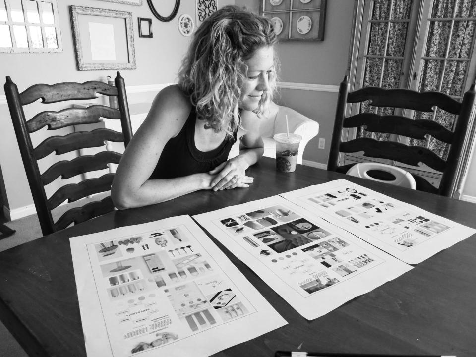 A potential Baby Barista customer looks at designs and plans for the machine, which instantly produces formula for waiting babies.