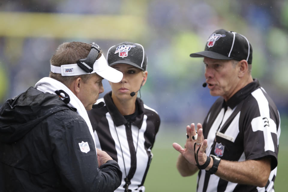 New Orleans Saints head coach Sean Payton, left, talks with officials during the first half of an NFL football game against the Seattle Seahawks, Sunday, Sept. 22, 2019, in Seattle. (AP Photo/Scott Eklund)