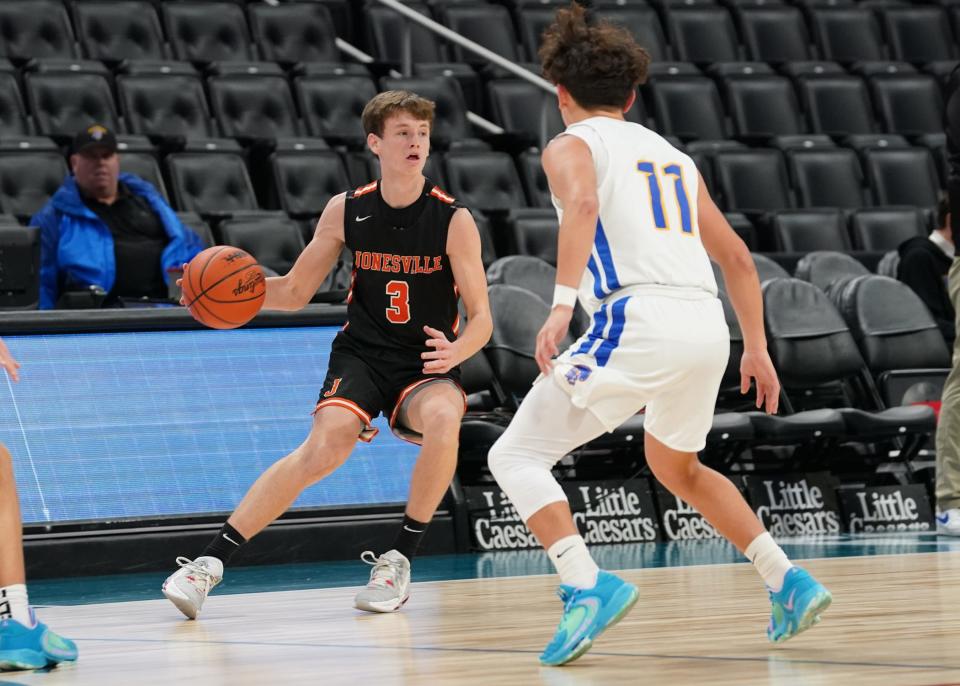 Jonesville's Brady Wright (3) handles the ball during Tuesday's game against Adrian Madison at Little Caesars Arena in Detroit.