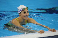 Australia's Stephanie Rice talks with teammates in the pool during a training session for the swimming competition in the FINA World Championships at the indoor stadium of the Oriental Sports Centre in Shanghai on July 22, 2011. (PETER PARKS/AFP/Getty Images)