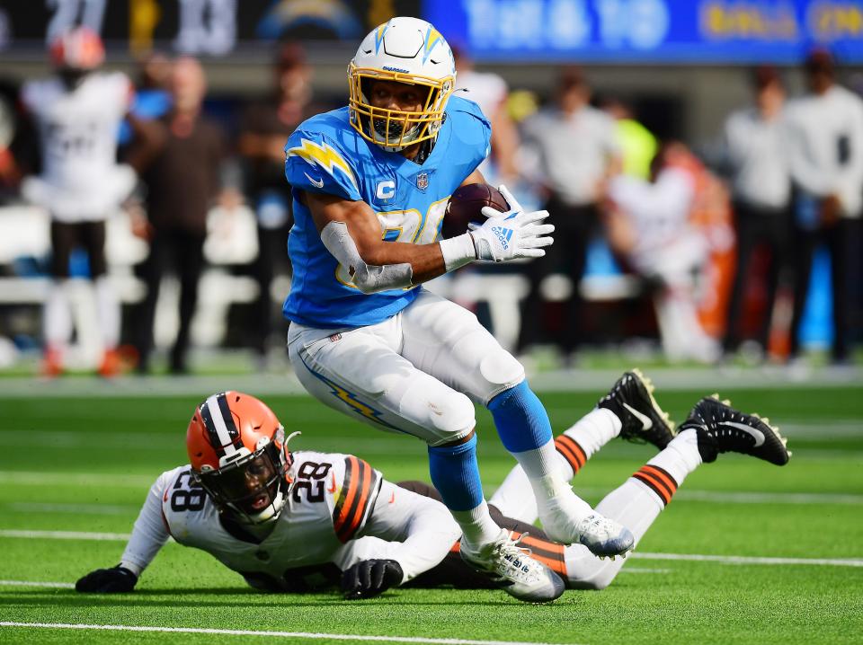 Chargers running back Austin Ekeler runs the ball ahead of Browns outside linebacker Jeremiah Owusu-Koramoah during the second half, Oct. 10, 2021, Inglewood, Calif. (Gary A. Vasquez-USA TODAY Sports)