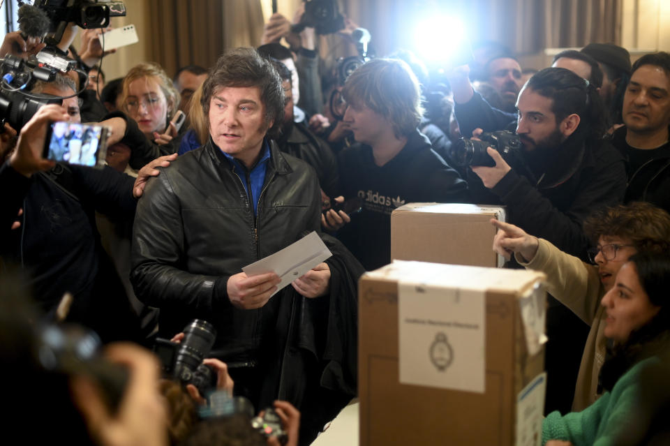 Javier Milei, presidential hopeful of the Liberty Advances coalition, votes during primary elections in Buenos Aires, Argentina, Sunday, Aug. 13, 2023. (AP Photo/Mario De Fina)