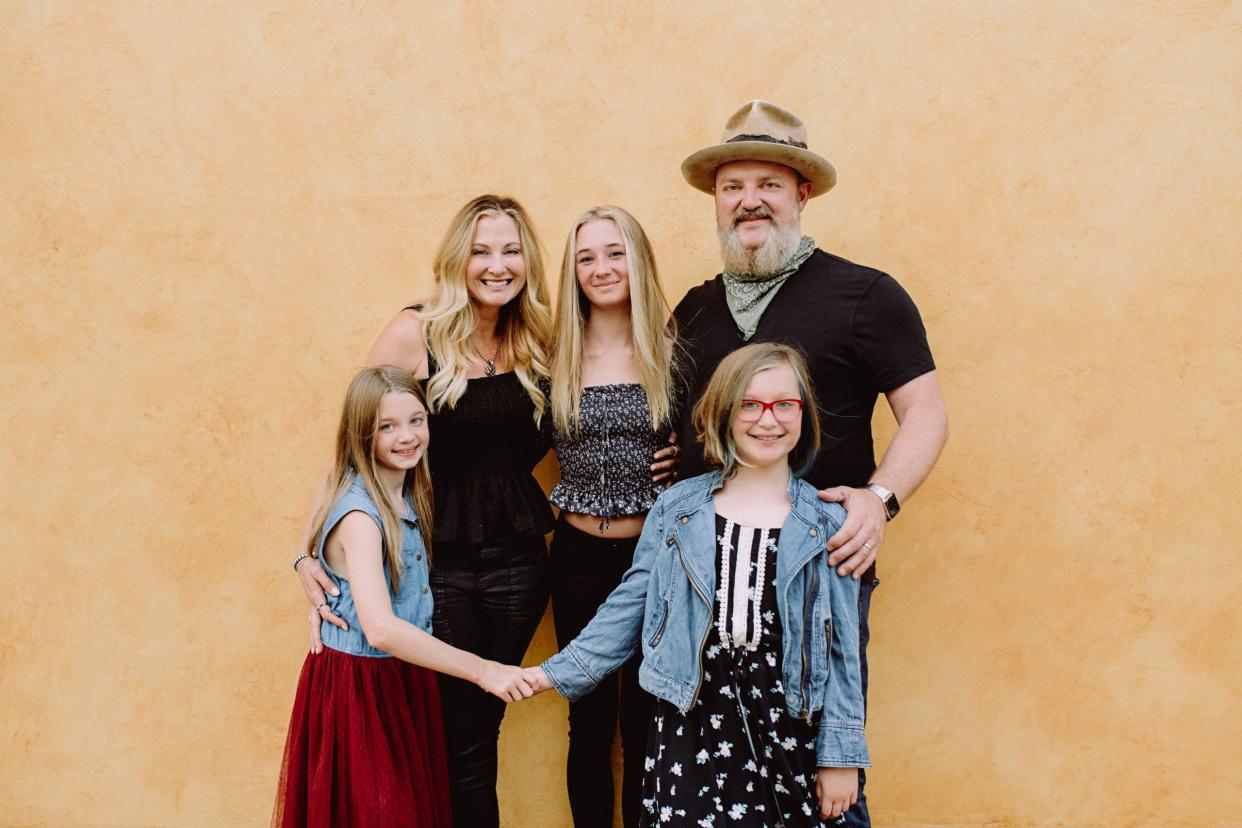 A photo of John Driskell Hopkins with wife and kids