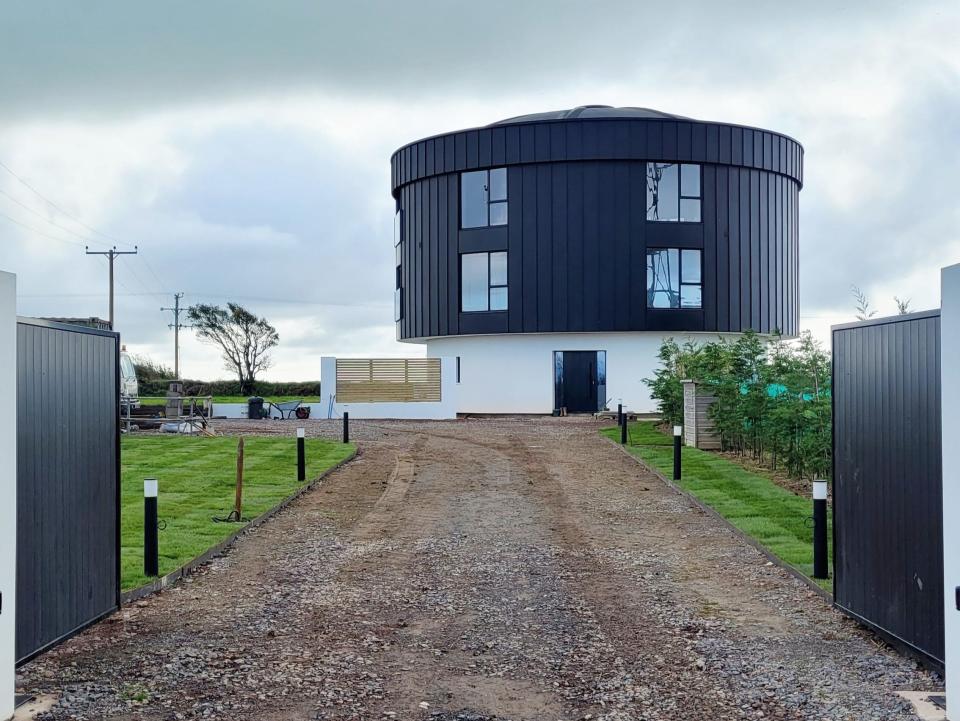 The house as viewed from the gate.