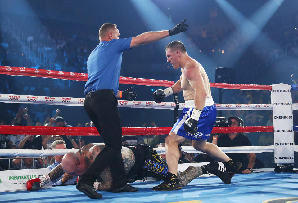 Paul Gallen knocks down Lucas Browne and wins by TKO during their bout at WIN Entertainment Centre.