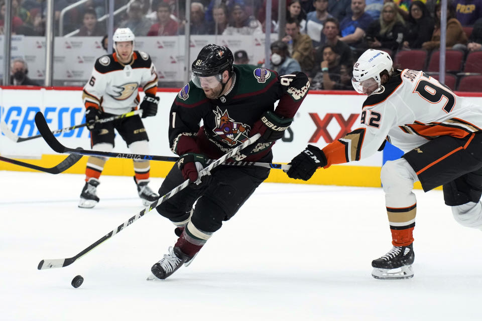 Arizona Coyotes right wing Phil Kessel shields the puck from Anaheim Ducks defenseman Andrej Sustr (92) during the second period of an NHL hockey game Friday, April 1, 2022, in Glendale, Ariz. (AP Photo/Rick Scuteri)