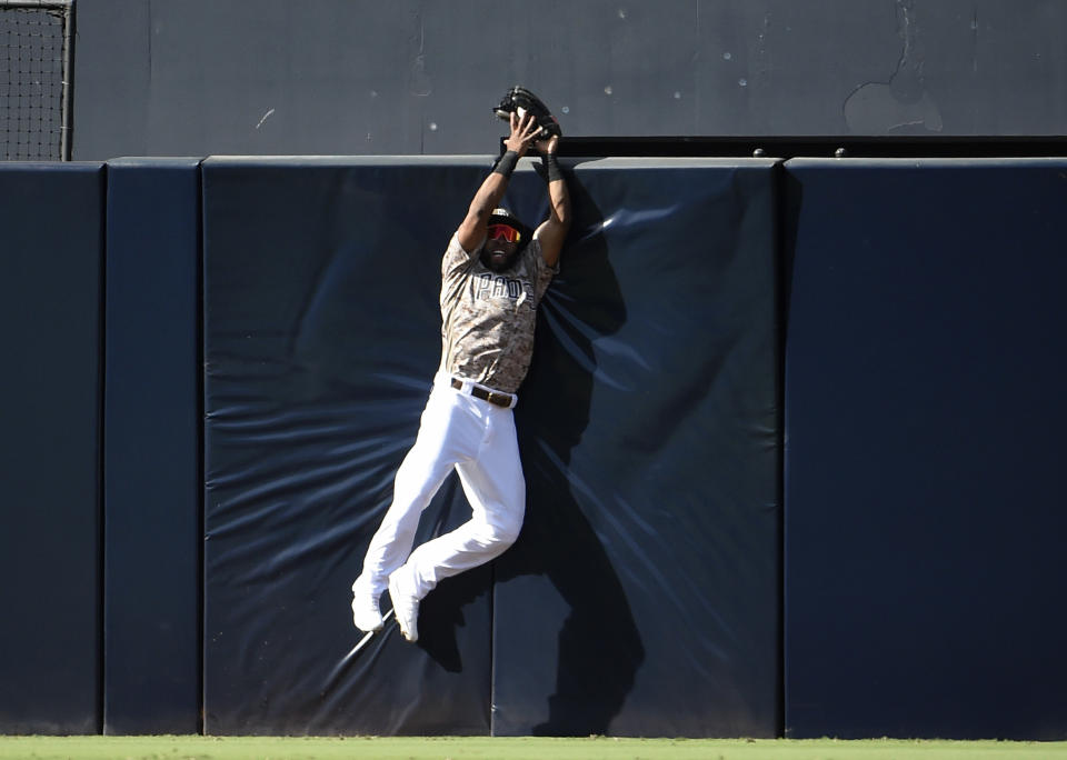 SAN DIEGO, CA - SEPTEMBER 22: Manuel Margot #7 of the San Diego Padres makes a catch at the wall to take away a home run from Christian Walker #53 of the Arizona Diamondbacks during the the seventh inning of a baseball game at Petco Park September 22, 2019 in San Diego, California.  (Photo by Denis Poroy/Getty Images)