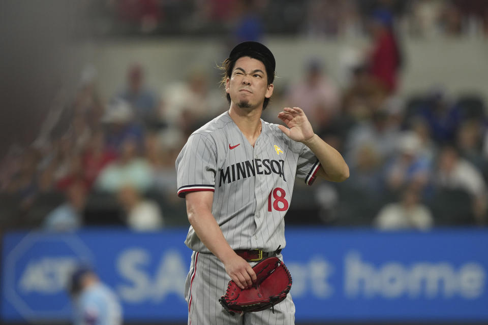 Minnesota Twins starting pitcher Kenta Maeda walks to the dugout after the third inning of a baseball game against the Texas Rangers in Arlington, Texas, Sunday, Sept. 3, 2023. (AP Photo/LM Otero)