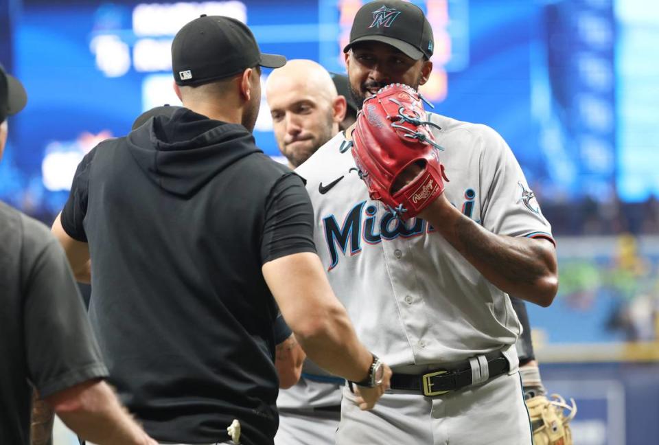 Jul 26, 2023; St. Petersburg, Florida, USA; Miami Marlins starting pitcher Sandy Alcantara (22) is congratulated after he threw a complete game against the Tampa Bay Rays at Tropicana Field. Kim Klement/USA TODAY Sports