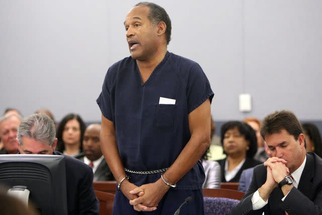 <p>Issac Brekken-Pool/Getty</p> O.J. Simpson (center) speaks in court prior to his sentencing at the Clark County Regional Justice Center on Dec. 5, 2008 in Las Vegas