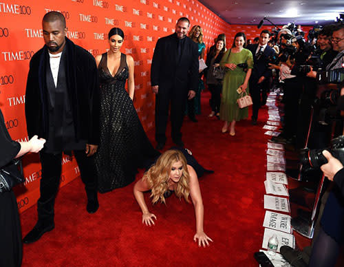 <em>Amy Schumer</em> made sure to show Kanye West and Kim Kardashian the reverence they enjoy receiving when she got down on her hands and knees to worship them on the red carpet at the 2015 <em>TIME </em>100 gala in New York City on Tuesday. The actress and comedian -- who recently did a hilarious job hosting the MTV Movie Awards -- dropped to the floor and bowed down at the power couple's feet in one of the funniest and most uncomfortable displays of adoration ever. <strong>VIDEO: The 6 Most Outrageously Inappropriate Moments at the MTV Movie Awards </strong> While Amy prostrated himself at the altar of Kimye, the 37-year-old rapper -- who was set to perform at the star-studded event -- didn't look like he was in the mood for her shenanigans. Or maybe that's just how he always looks on red carpets, it's hard to tell. Getty Images Kim, meanwhile, looked to be politely entertained by Amy's antics, which were caught at every angle by the throng of press photographers. Getty Images Amy's popular Comedy Central sketch show <em>Inside Amy Schumer</em> returns Tuesday for its fourth season. It's unclear if Amy's prank was possibly a publicity stunt, or just an attempt to make the couple as wildly uncomfortable as possible. Either way, it seemed to work. <strong>VIDEO: Kanye West Insists He's Not Part of the Illuminati </strong> Later in the evening, Amy tweeted a photo of her glorious moment, and thanked Time for the opportunity to get a little crazy. Thanks #TIME100 pic.twitter.com/bdAjImc5J5— Amy Schumer (@amyschumer) April 22, 2015 Aside from her sketch show, Amy is also starring in the upcoming comedy <em>Trainwreck</em>, opposite Bill Hader. Check out the trailer for the highly anticipated comedy below.