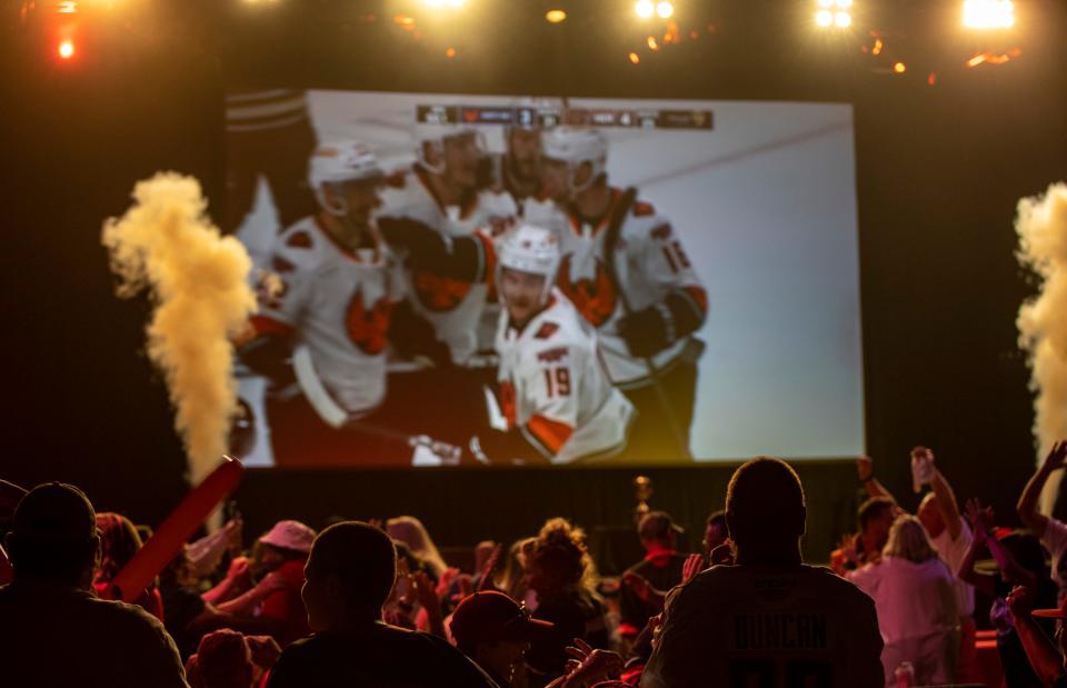 Coachella Valley Firebirds fans celebrate a goal by Cameron Hughes to tie the game with under a minute left in the third period during a watch party for Game 3 of the Calder Cup Finals at Spotlight 29 Casino in Coachella, Calif., Tuesday, June 13, 2023. 