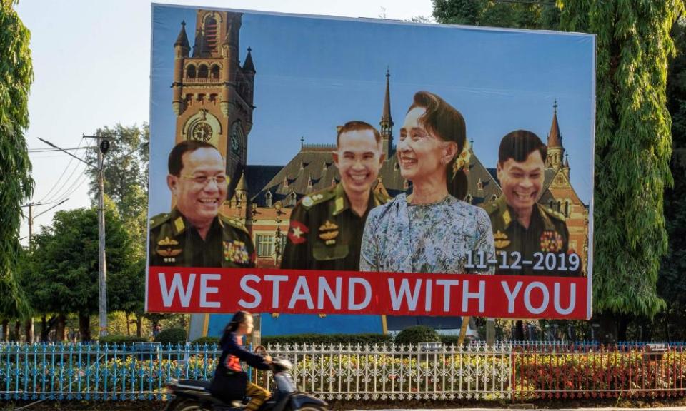 A huge billboard depicting Aung San Su Kyi with three military ministers displayed along a main road in Karen state, Myanmar.