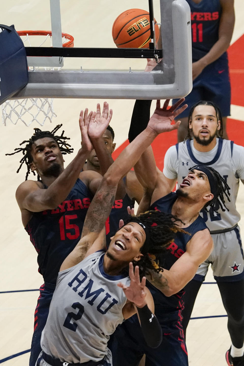 Robert Morris forward Kahliel Spear (2), Dayton forward DaRon Holmes II (15) and Dayton forward Toumani Camara, right, fight for a rebound during the second half of an NCAA college basketball game, Saturday, Nov. 19, 2022, in Dayton, Ohio. (AP Photo/Joshua A. Bickel)