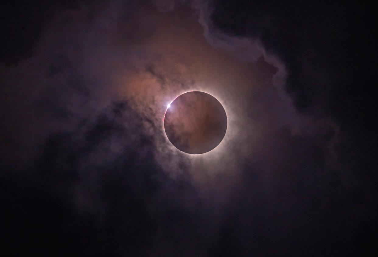 The last glint of sunlight appears on the edge of the moon creating the 'diamond ring' effect just before the start of the total solar eclipse on April 8, 2024. Although clouds were present throughout the eclipse from the author's viewing site near Fredericksburg, Texas, the clouds thinned enough for a good view of the total eclipse. It was the last total eclipse of the sun over the continental U.S. for 20 years.
