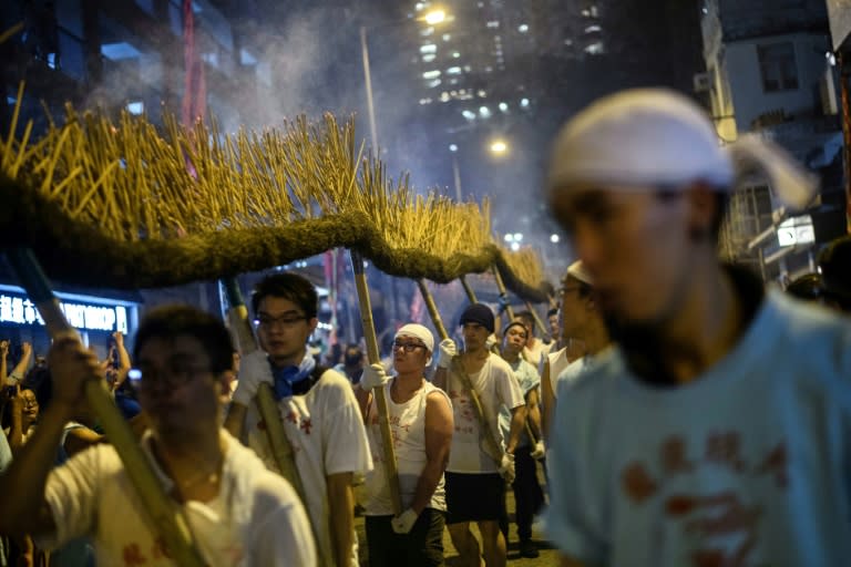 Participants take part in the annual Tai Hang "fire dragon" event, one of the highlights of the city's mid-autumn festival, in Hong Kong