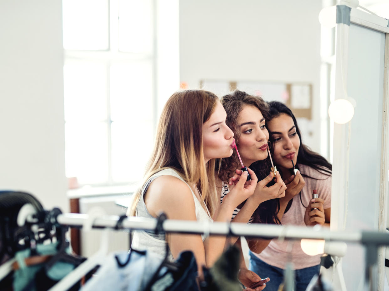 Women applying make-up. (PHOTO: Getty Images)