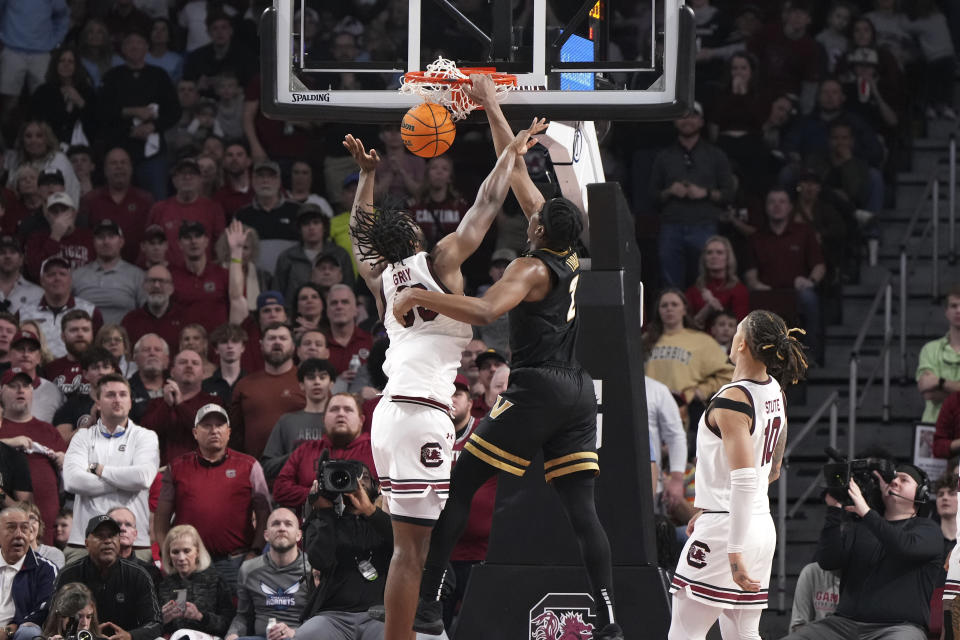 Vanderbilt forward Ven-Allen Lubin (2) dunks the ball against South Carolina forward Josh Gray (33) during the second half of an NCAA college basketball game Saturday, Feb. 10, 2024, in Columbia, S.C. (AP Photo/David Yeazell)