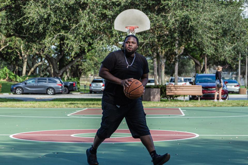 Nate Ferguson, 29, from Deerfield Beach practices his basketball game at Patch Reef Park in Boca Raton. (JOSEPH FORZANO / THE PALM BEACH POST)