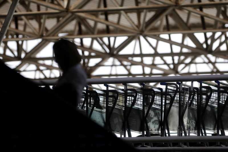 A traveller walks at Brazilian International Airport amid the coronavirus disease (COVID-19) outbreak in Brasilia