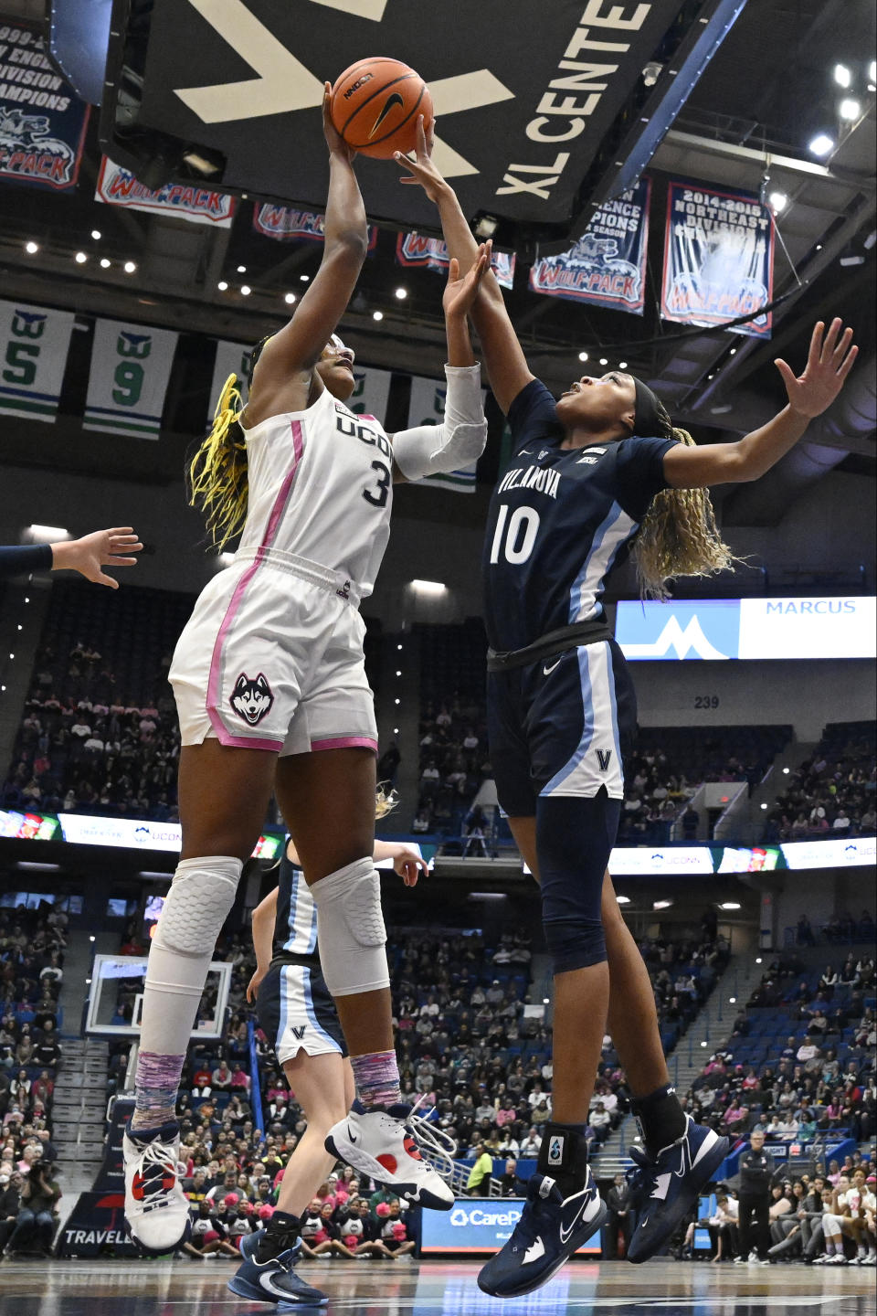 Villanova's Christina Dalce (10) blocks a shot attempt by UConn's Aaliyah Edwards (3) in the first half of an NCAA college basketball game, Sunday, Jan. 29, 2023, in Hartford, Conn. (AP Photo/Jessica Hill)