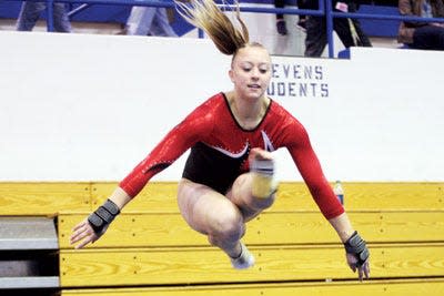 Deuel senior Sam Wiekamp competes in the floor exercise Saturday during the Class A Individual and All-Around Championship in the 2013 State High School Gymnastics Meet. Wiekamp shared the Class A vault title with teammate Meaghan Sievers. Wiekamp finished her career with a state Class A record of 19 individual titles.