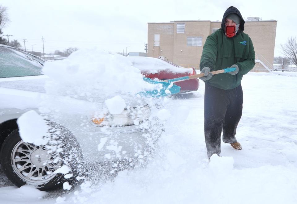 James Harder of Springfield shovels snow from the driveway of his home on West Lawrence Avenue  Wednesday, Feb. 2, 2022. [Thomas J. Turney The State Journal Register]