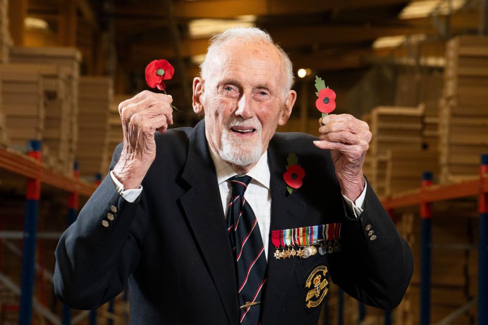 99-year-old D-Day veteran John Roberts, who served in the Royal Navy for 40 years, holding the new plastic-free paper poppy, the first redesign of the poppy for 28 years, at the Royal British Legion's Poppy Appeal Warehouse in Aylesford, for the launch of the Royal British Legion Poppy Appeal 2023. Picture date: Thursday October 26, 2023.