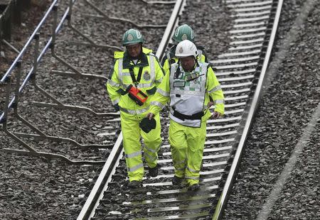 Emergency services attend the scene of a train derailment on the Euston to Milton Keynes line, at Hunton Bridge tunnel, north of Watford Junction station, Britain September 16, 2016. REUTERS/Eddie Keogh