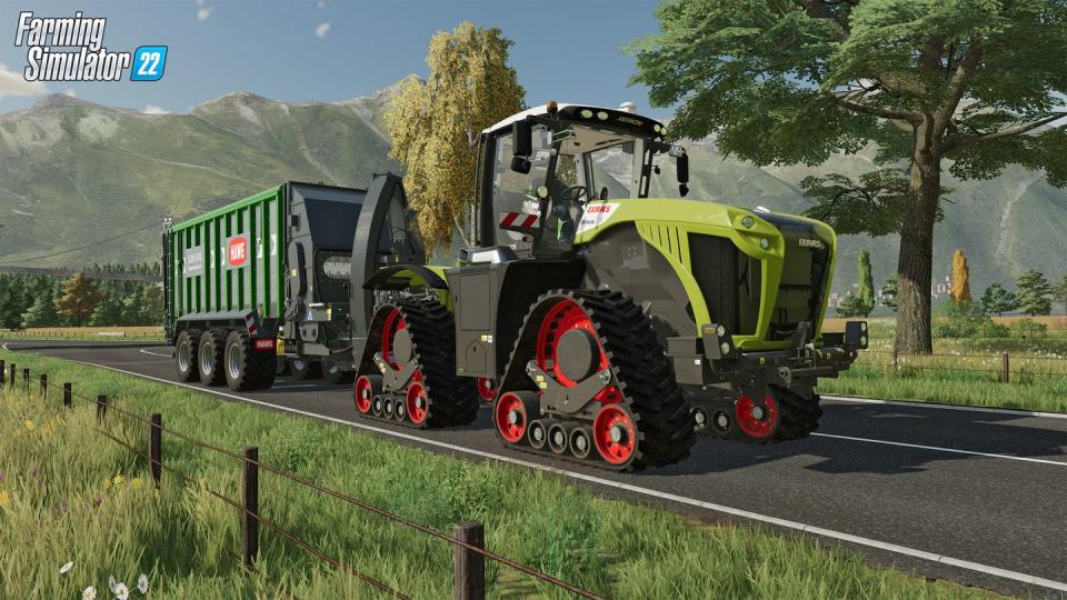 farming simulator 22, a tractor drives on a road in the countryside
