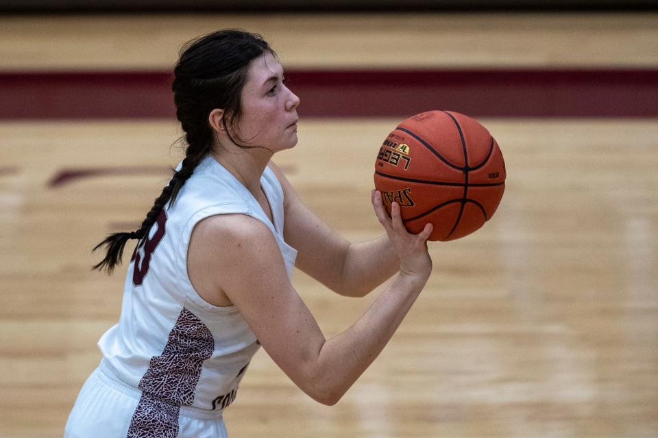 Henderson’s Brooklyn Gibson (33) takes a three-point shot as the Henderson County Lady Colonels play the Daviess County Lady Panthers at Henderson County High School Friday night, Jan. 6, 2023.