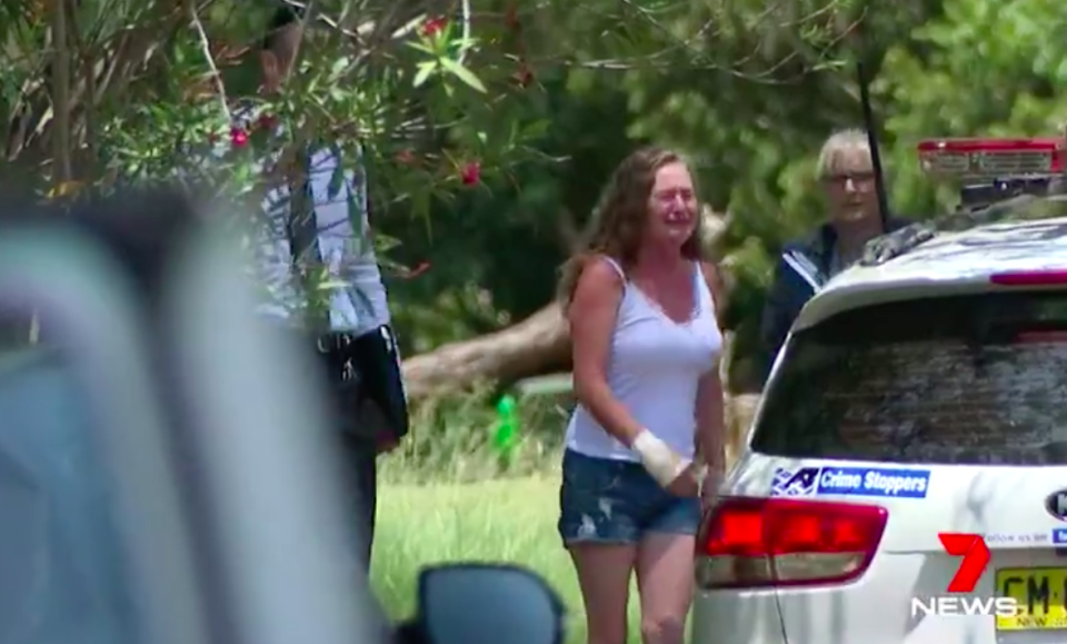 Robyn Coble grieves the death of her husband outside their North Richmond home on Monday. Source: 7News