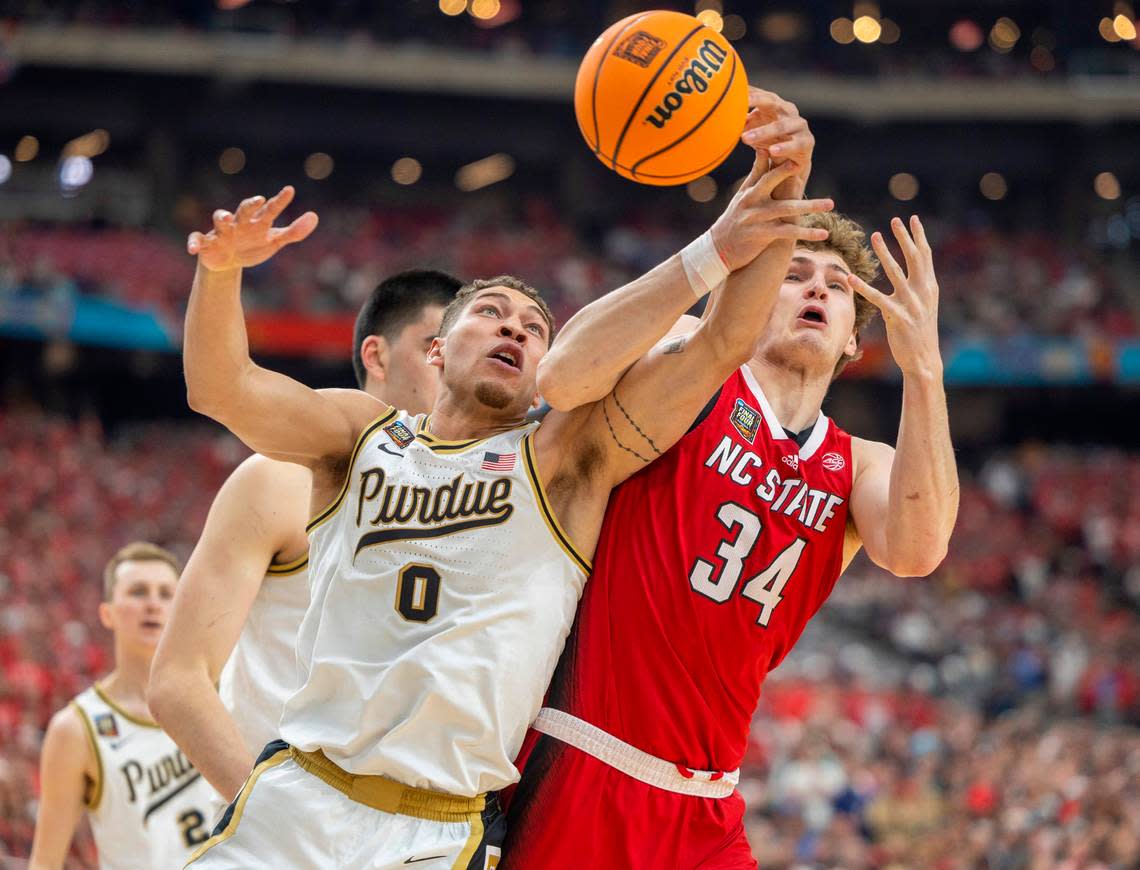 Purdue’s Mason Gillis (0) battles with N.C. State’s Ben Middlebrooks (34) for a rebound during the first half in the NCAA Final Four National Semifinal on Saturday, April 6, 2024 at State Farm Stadium in Glendale, AZ.