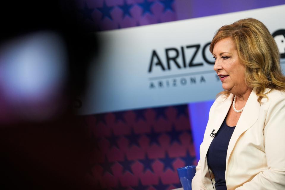 Kim Owens prepares before a debate for the office of Arizona Corporation Commissioner on Wednesday, June 22, 2022, in Phoenix.