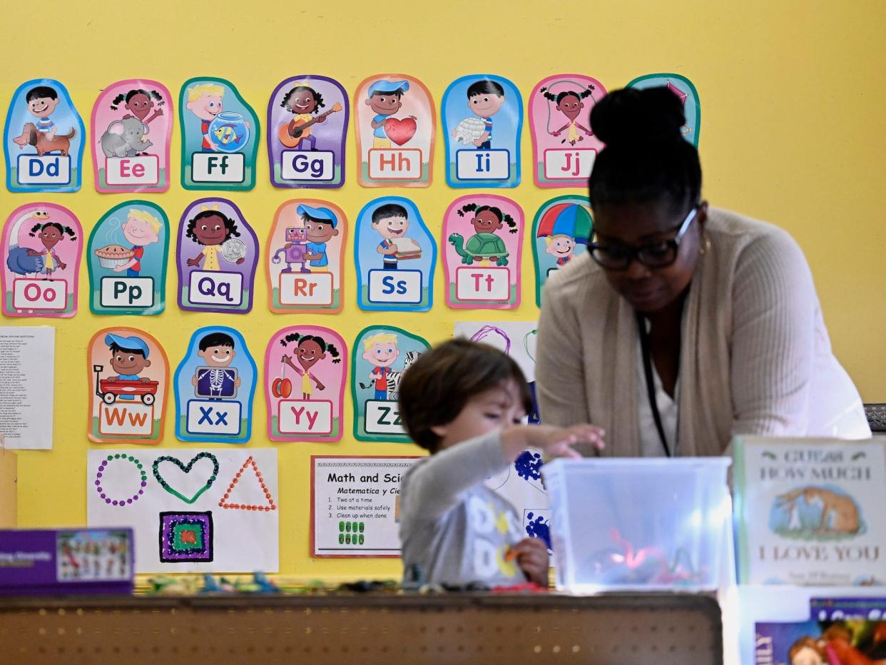 Alliance for Community Empowerment, Director of Early Learning Tanya Lloyd, right, interacts with a child in the Head Start program, Thursday, Sept. 28, 2023, in Bridgeport, Connecticut.