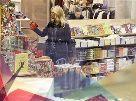 A woman shops in downtown Seattle, Washington November 16, 2013. REUTERS/Jason Redmond