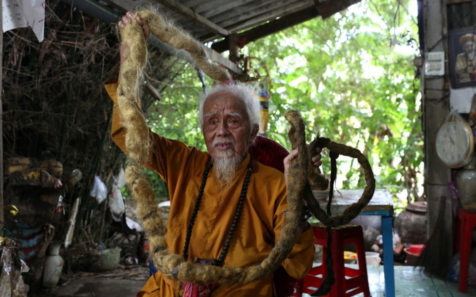 Mr Chien had not washed or combed his hair since he was a child - REUTERS