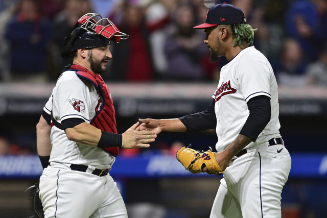 Cleveland Guardians relief pitcher Emmanuel Clase, right, is congratulated by catcher Mike Zunino after they defeated the St. Louis Cardinals in a baseball game, Friday, May 26, 2023, in Cleveland. (AP Photo/David Dermer)