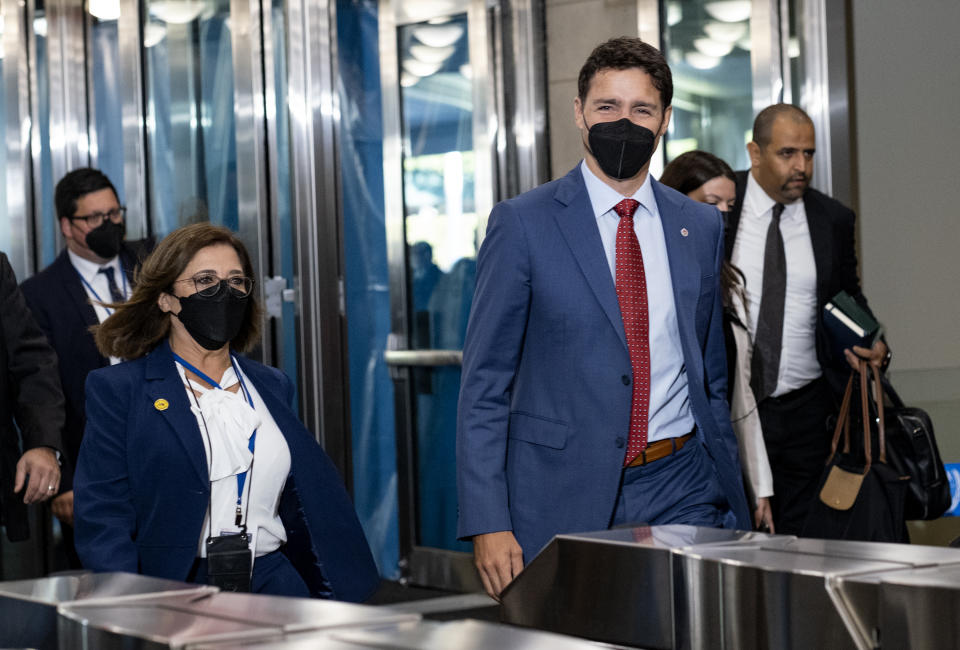 Canada's Prime Minister Justin Trudeau, right, arrives at the United Nations headquarters for the 77th United Nations General Assembly Tuesday, Sept. 20, 2022. (AP Photo/Craig Ruttle)