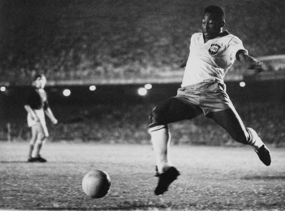 As a 17-year-old, Pelé burst on the global scene at the 1958 World Cup. <a href="https://www.gettyimages.com/detail/news-photo/brazilian-footballer-pele-playing-for-brazil-circa-1958-news-photo/496570815?phrase=pele&adppopup=true" rel="nofollow noopener" target="_blank" data-ylk="slk:Pictorial Parade/Archive Photos/Getty Images;elm:context_link;itc:0;sec:content-canvas" class="link ">Pictorial Parade/Archive Photos/Getty Images</a>