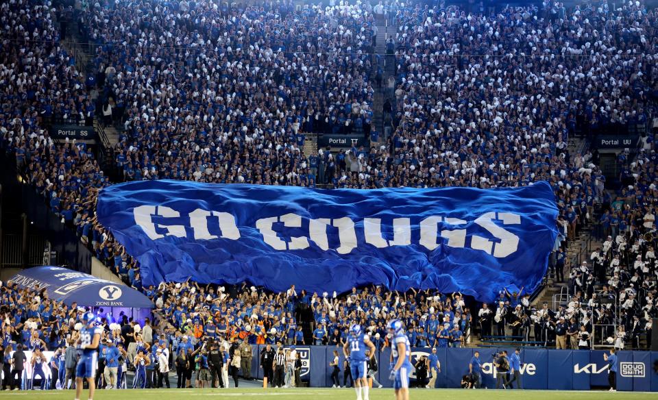 Fans cheer as the Brigham Young Cougars play the Cincinnati Bearcats in a football game at LaVell Edwards Stadium in Provo on Friday, Sept. 29, 2023. | Kristin Murphy, Deseret News