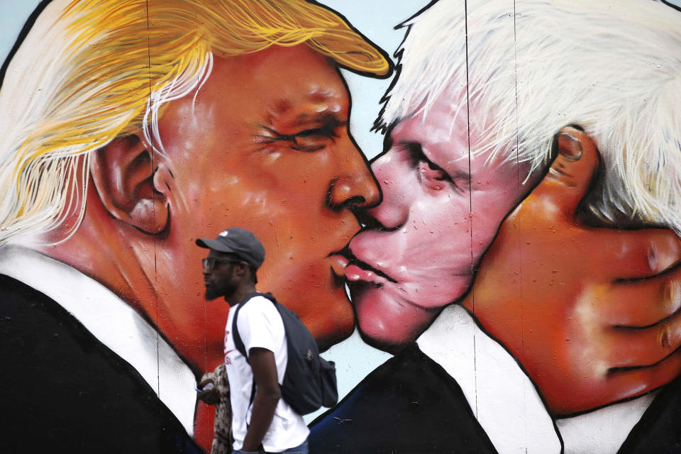 <p>A mural of Donald Trump embracing former London Mayor Boris Johnson is seen on a building in Bristol, England, on May 24, 2016. (Peter Nicholls/Reuters) </p>