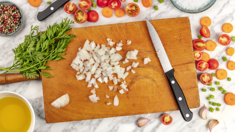 cutting board with chopped ingredients