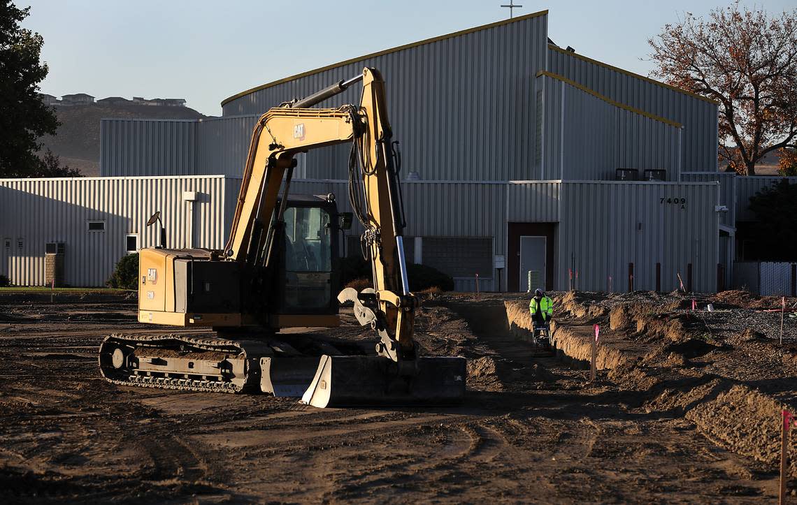 A construction worker compacts the dirt in a trench for the foundation of the new Clearwater Lofts construction project at 7275 W. Clearwater Ave. in Kennewick. The building will offer residential and commerical space. Bob Brawdy