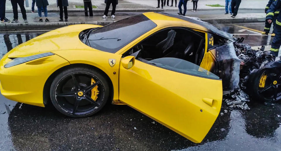 A bright yellow Ferrari destroyed by fire