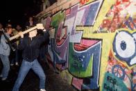 <p>A man takes the destruction of the Berlin Wall into his own hands. </p>